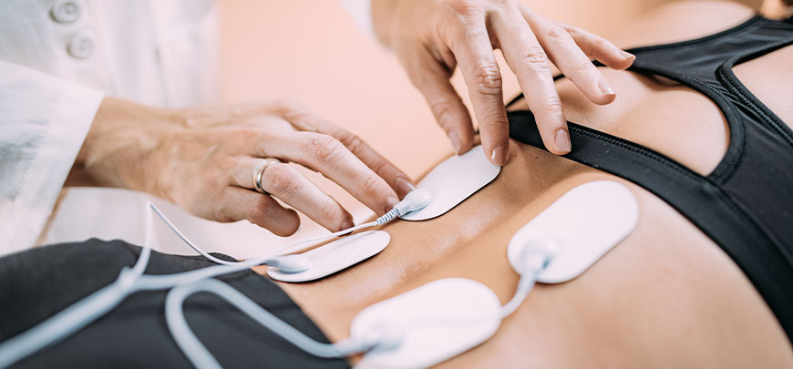 Patient receiving Electrical Muscle Stimulation in Port Saint Lucie for auto accident injury relief